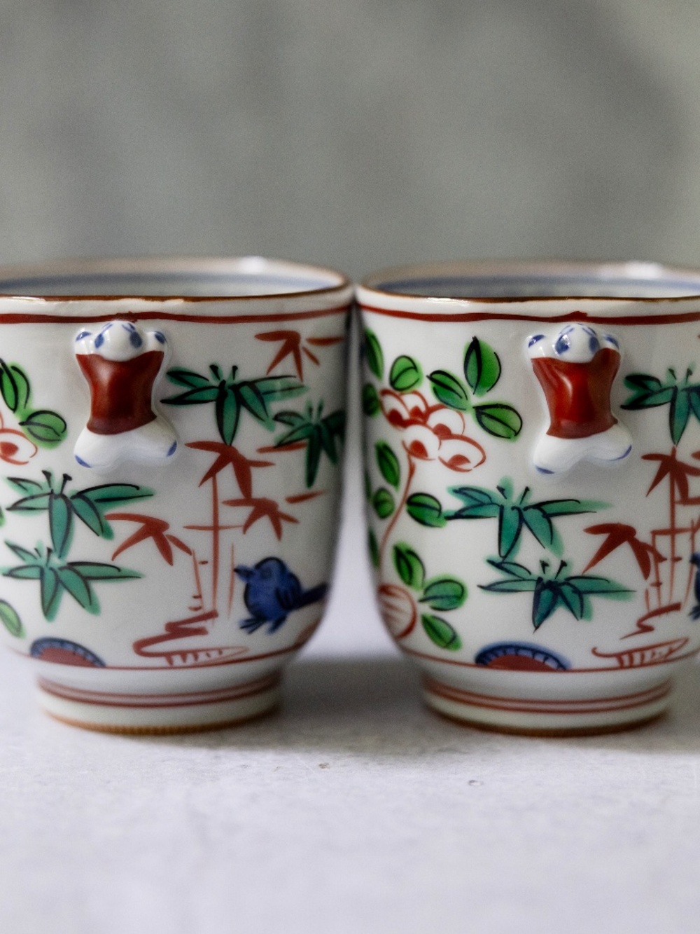 Set of 2 Kiyomizu Kyo Ware tea cups with climbing figure vintage Japanese